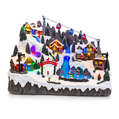 Aldeia de Natal luminosa com pistas de esqui e patinagem em movimento, luzes LED e música - 56x37x42 cm