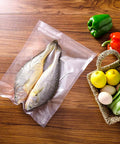 Sacchetti sottovuoto Reber 15x25cm con pesce fresco sigillato, verdure fresche nel cestino, conservazione ottimale alimenti